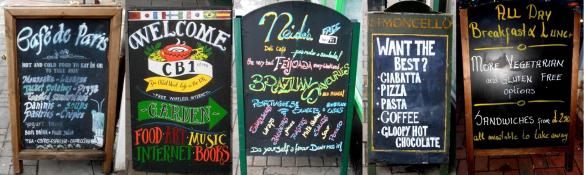 Boards outside some of the cafe's on Mill Road: (L-R) Cafe De Paris, CB1, Neide's Deli Cafe, Limoncello & Cafe Otto.
